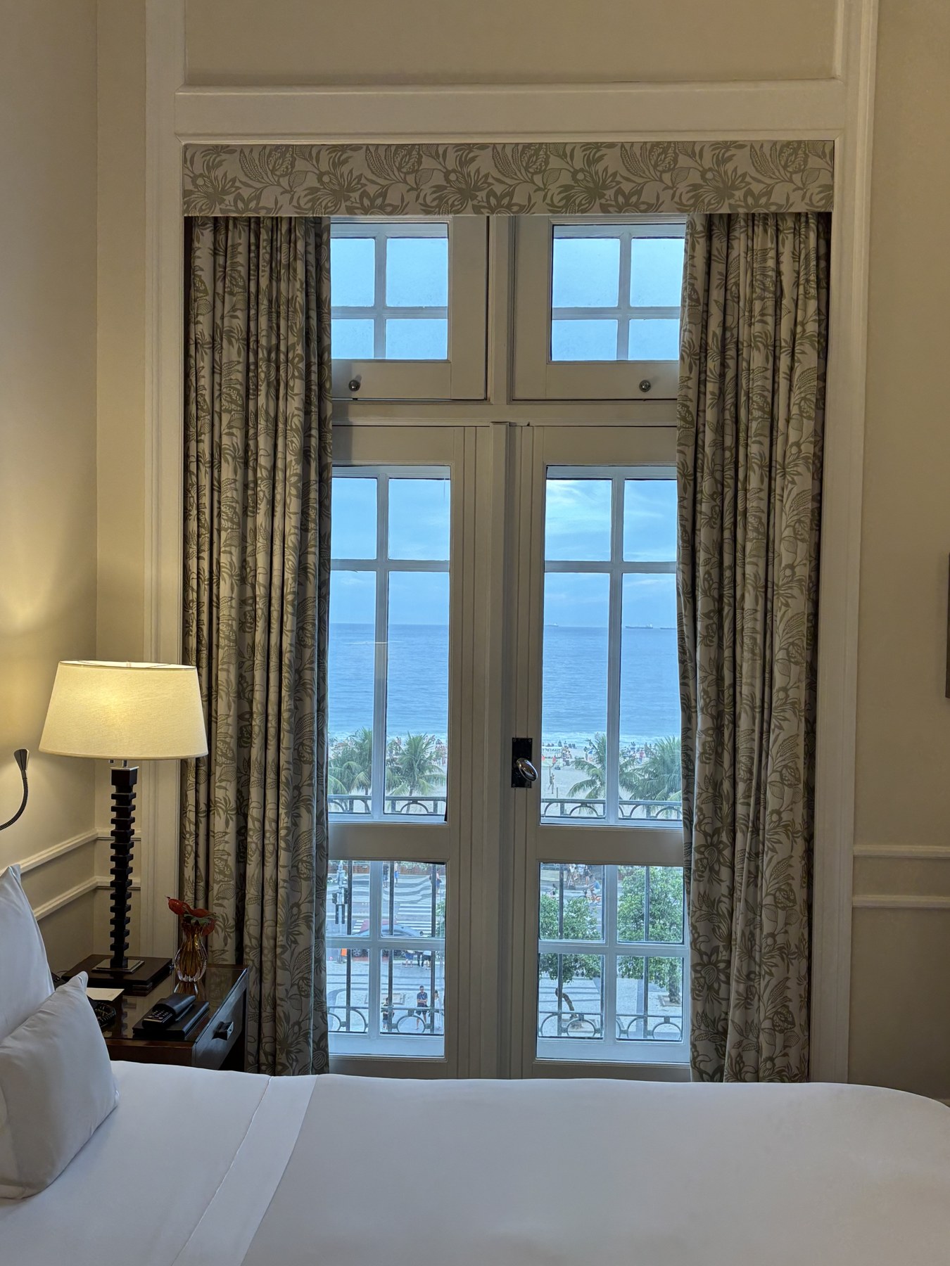 A guest room window at Copacabana Palace looking out over Rio de Janeiro
