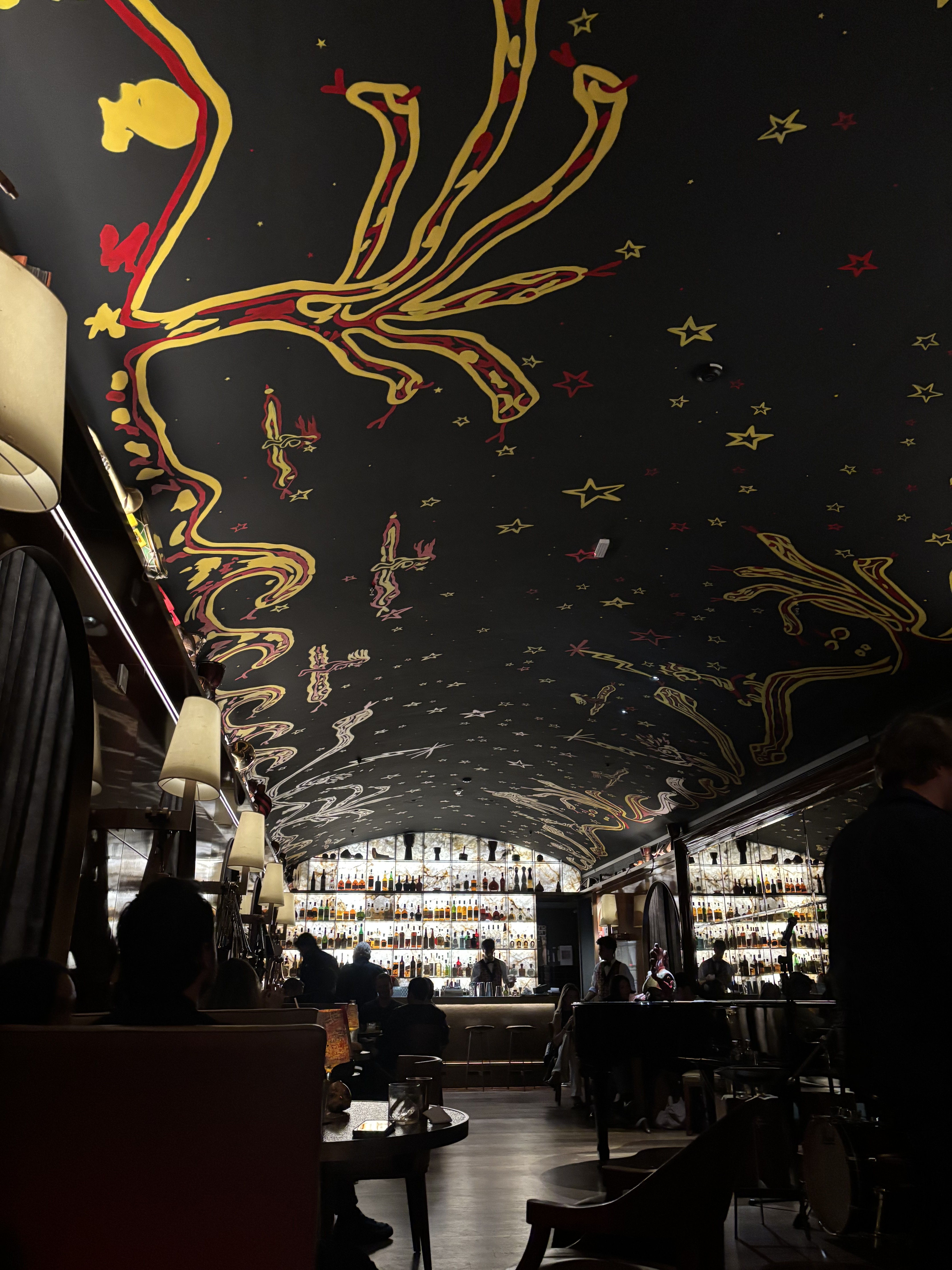 The dramatic painted ceiling of the bar at Rosewood São Paulo
